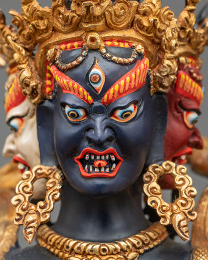 Face close-up of Kalachakra deity, gold-gilded copper, fierce expression
