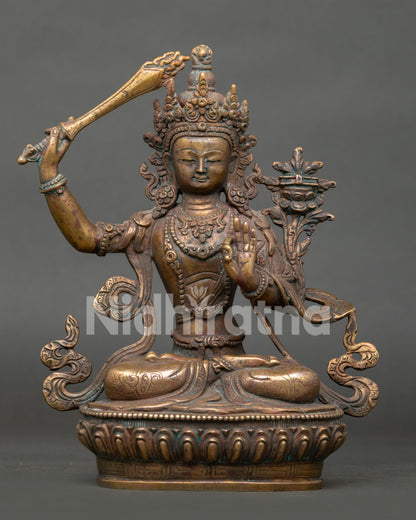 oxidized copper manjushri statue handcrafted in nepal with wisdom deity details