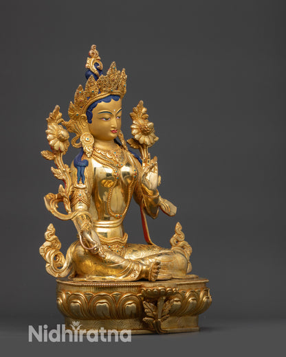 Side view Green Tara statue showing Varada and Vitarka mudra hands
