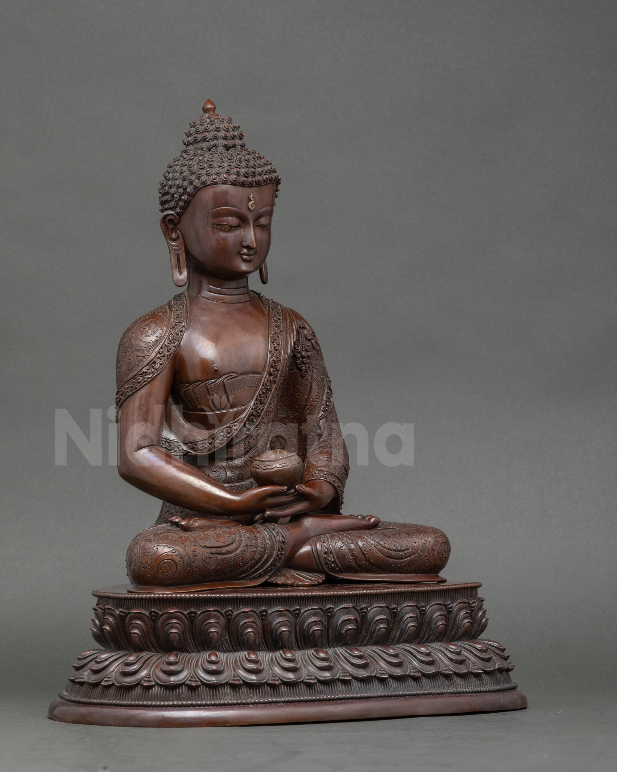 Side view oxidized Amitabha Buddha statue holding alms bowl, meditative mudra sculpture