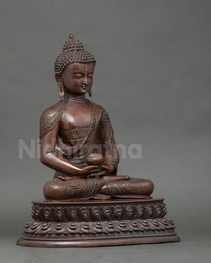 Side view oxidized Amitabha Buddha statue holding alms bowl, meditative mudra sculpture