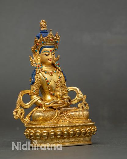 Side view Amitayus Buddha seated on lotus throne, adorned with semi-precious stones
