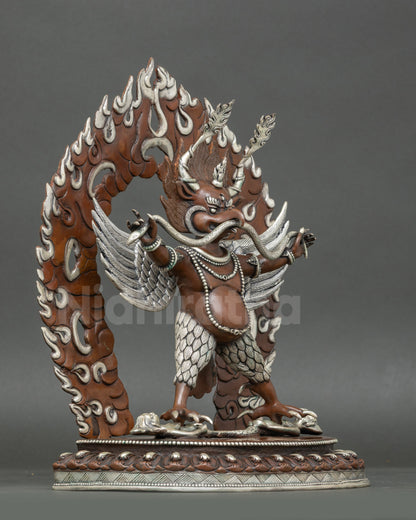 Side view Garuda statue with outstretched wings and powerful talons, Himalayan protector deity