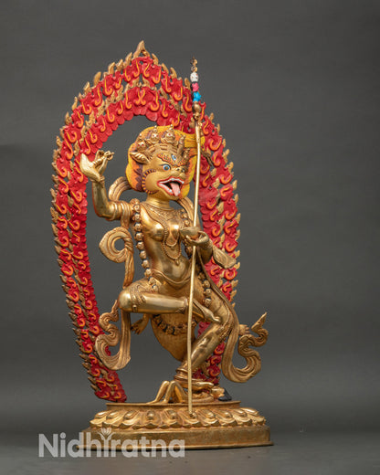 Side view Simhamukha statue highlighting dynamic robes, ritual weapons, and flowing garments