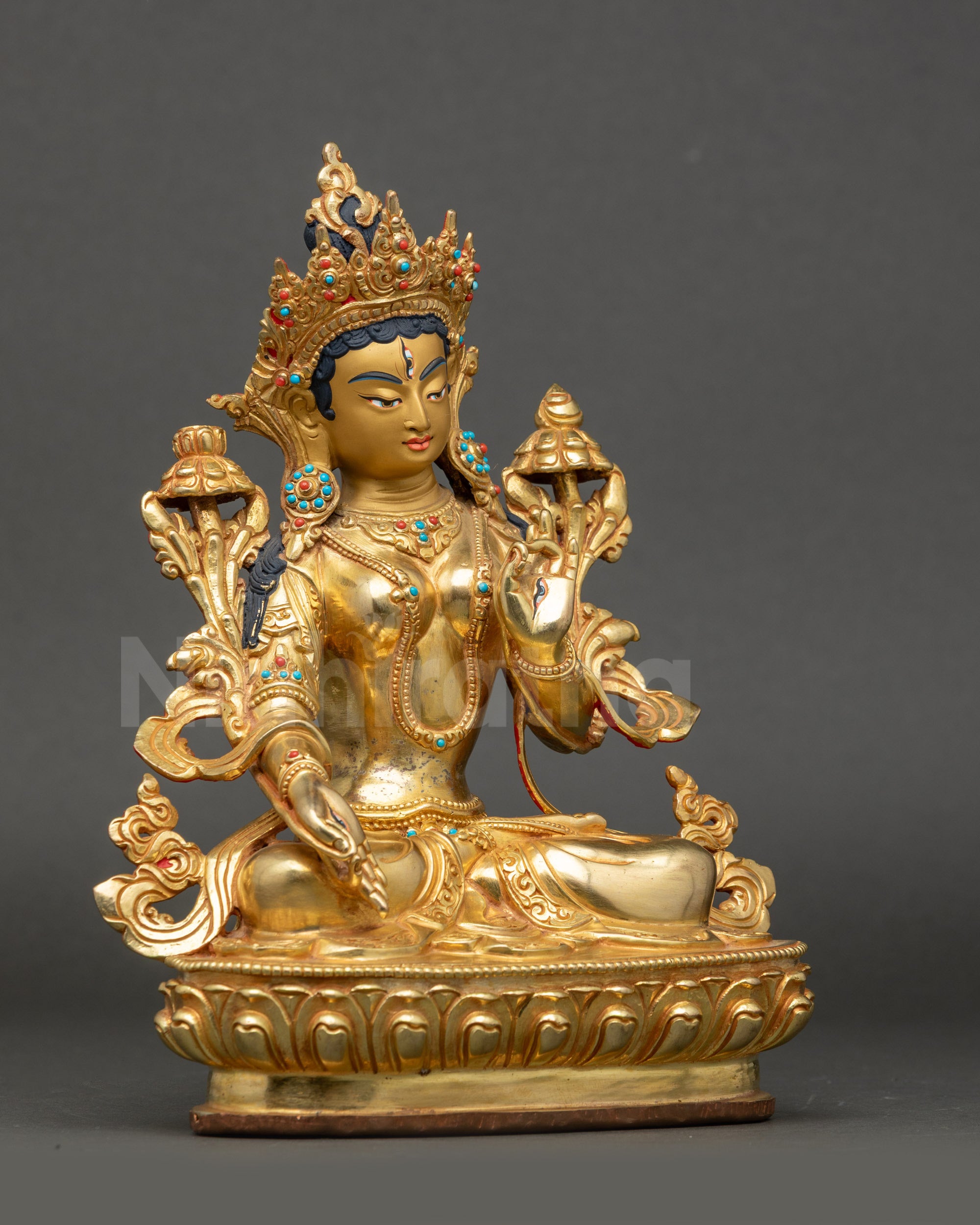 Side view White Tara statue seated on lotus throne Himalayan Buddhist art