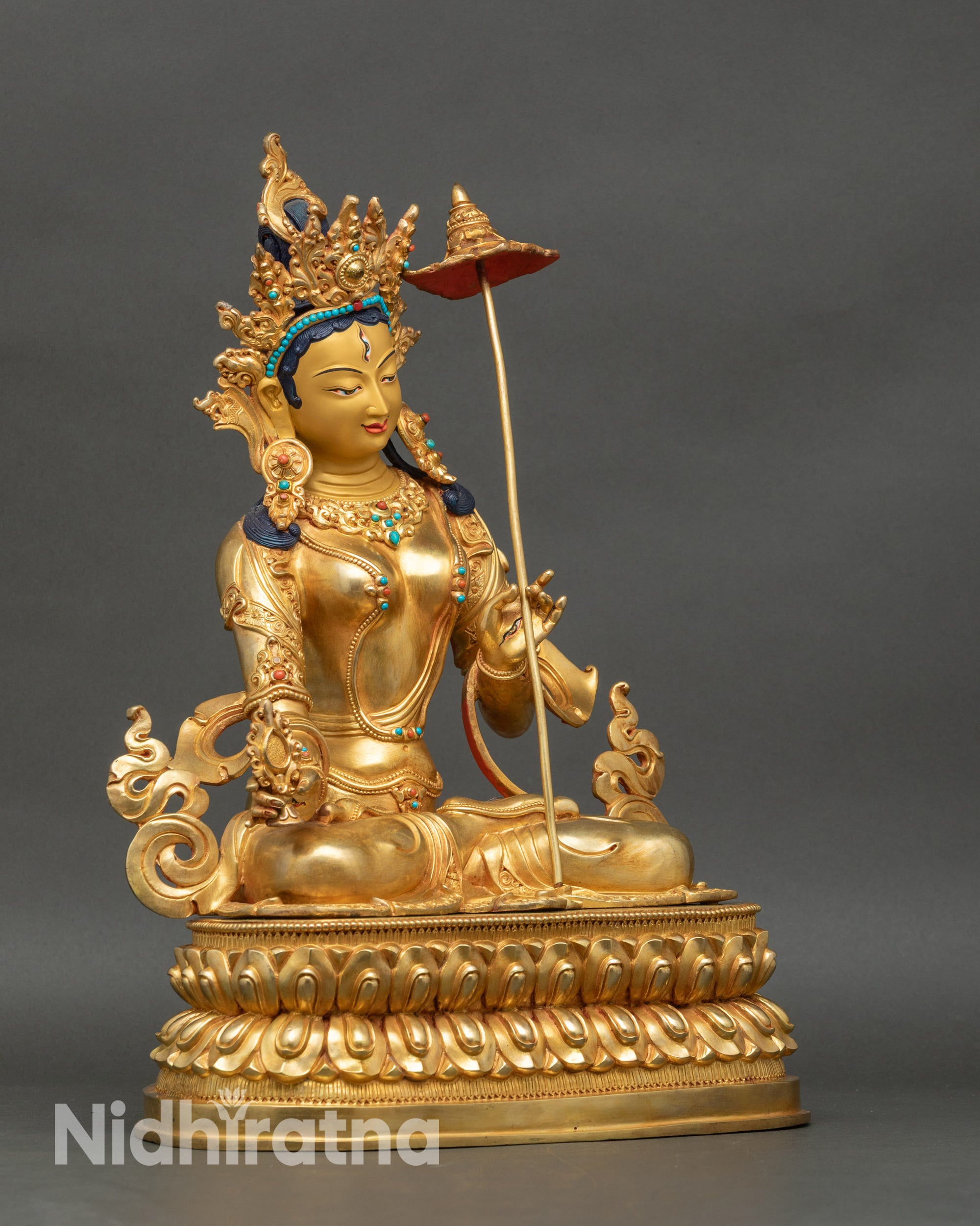 Side view Dukar holding parasol and Dharma Wheel copper statue Nepalese sacred art