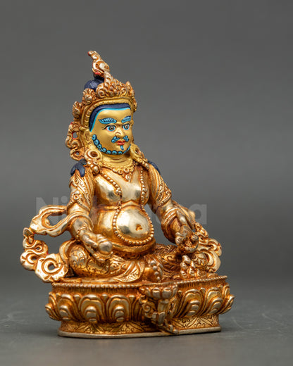 Side view Dzambhala statue copper gold-gilded Hindu-Buddhist deity meditation decor