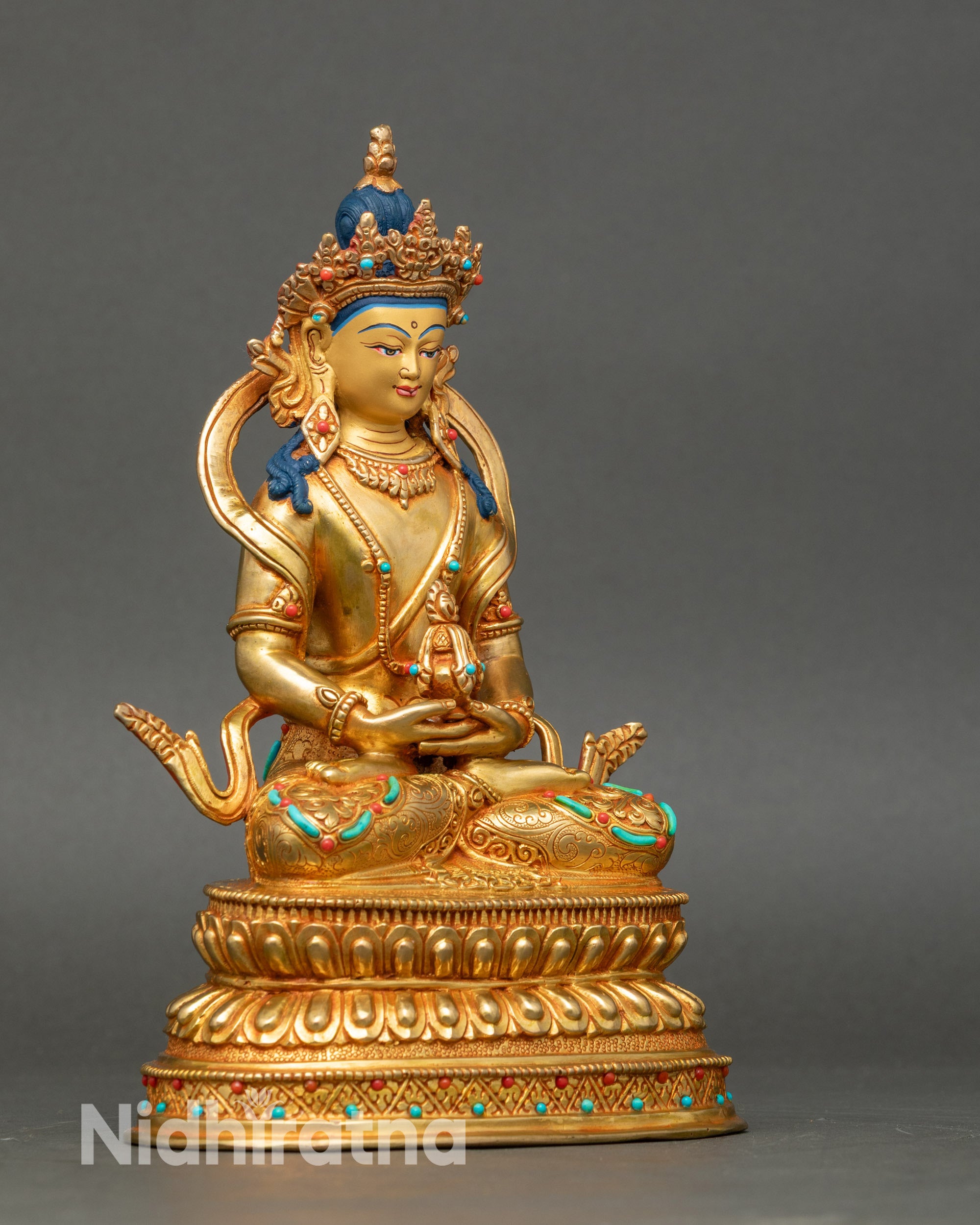 Side view Amitayus Buddha statue, seated on double lotus throne, holding medicinal vase