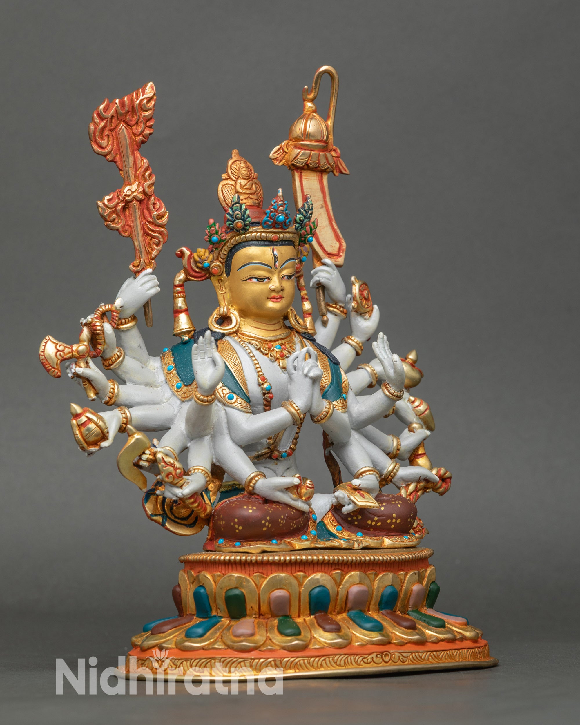 Side view: Side view Chundi statue with multiple arms, holding sacred implements and treasures
