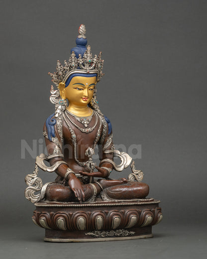 Side view Mitrugpa seated on lotus flowy garments handcrafted Newari sculpture
