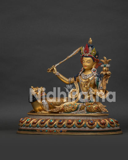 Left side view of Simhanada Manjushri statue showing gold gilded details