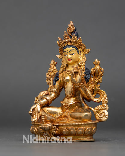 Green Tara figurine seated on lotus throne, symbol of compassion and protection