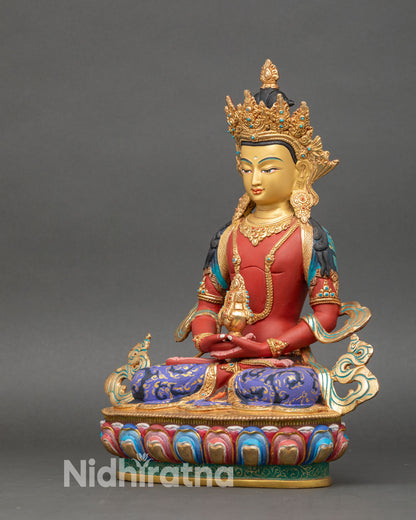 left side view of amitayus statue with gold-gilded ornaments and lotus pedestal