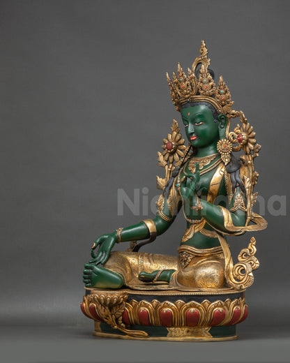 Left view side Green Tara statue highlighting gold-plated crown and flowing robes