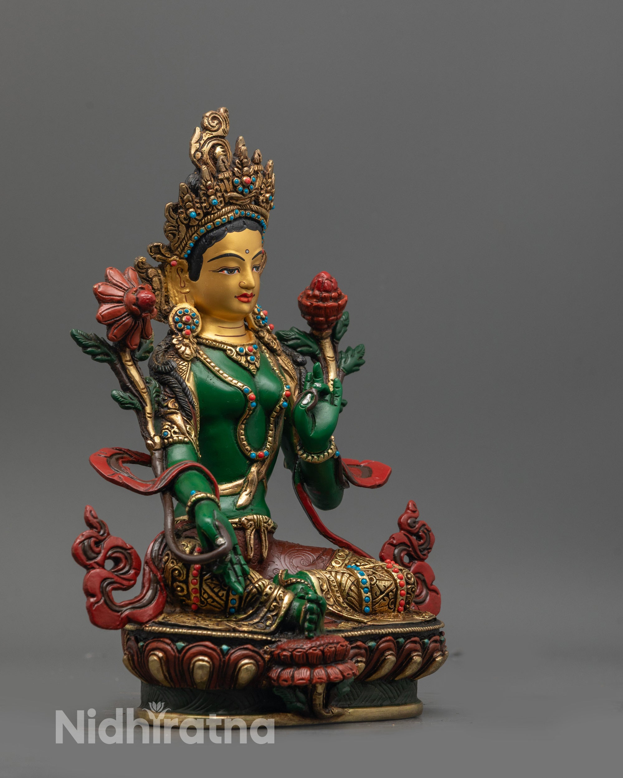Side view of Traditional Nepalese Green Tara statue showing serene expression