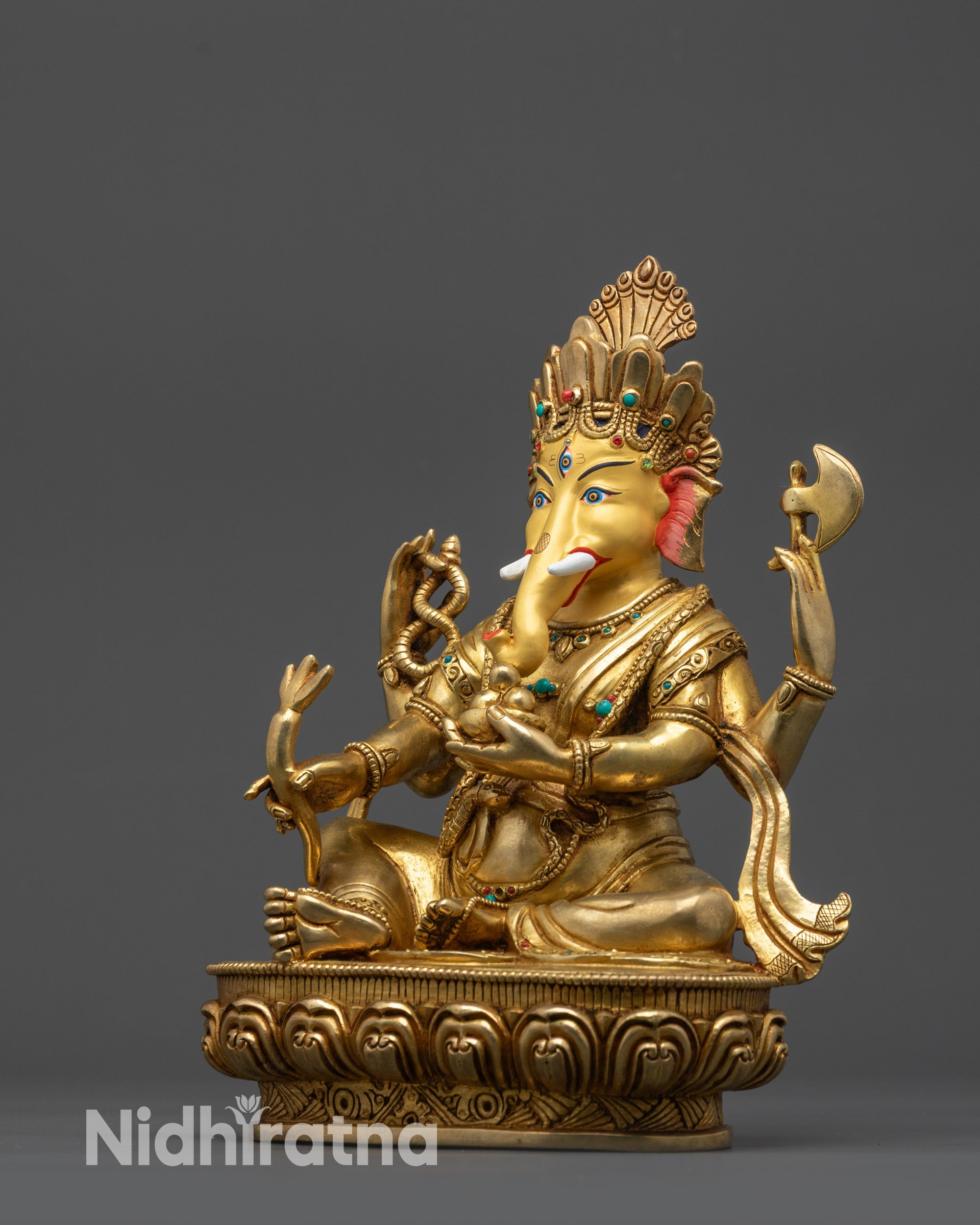 Four-armed Ganesha Statue | Spiritual Idol Crafted for Sacred Spaces