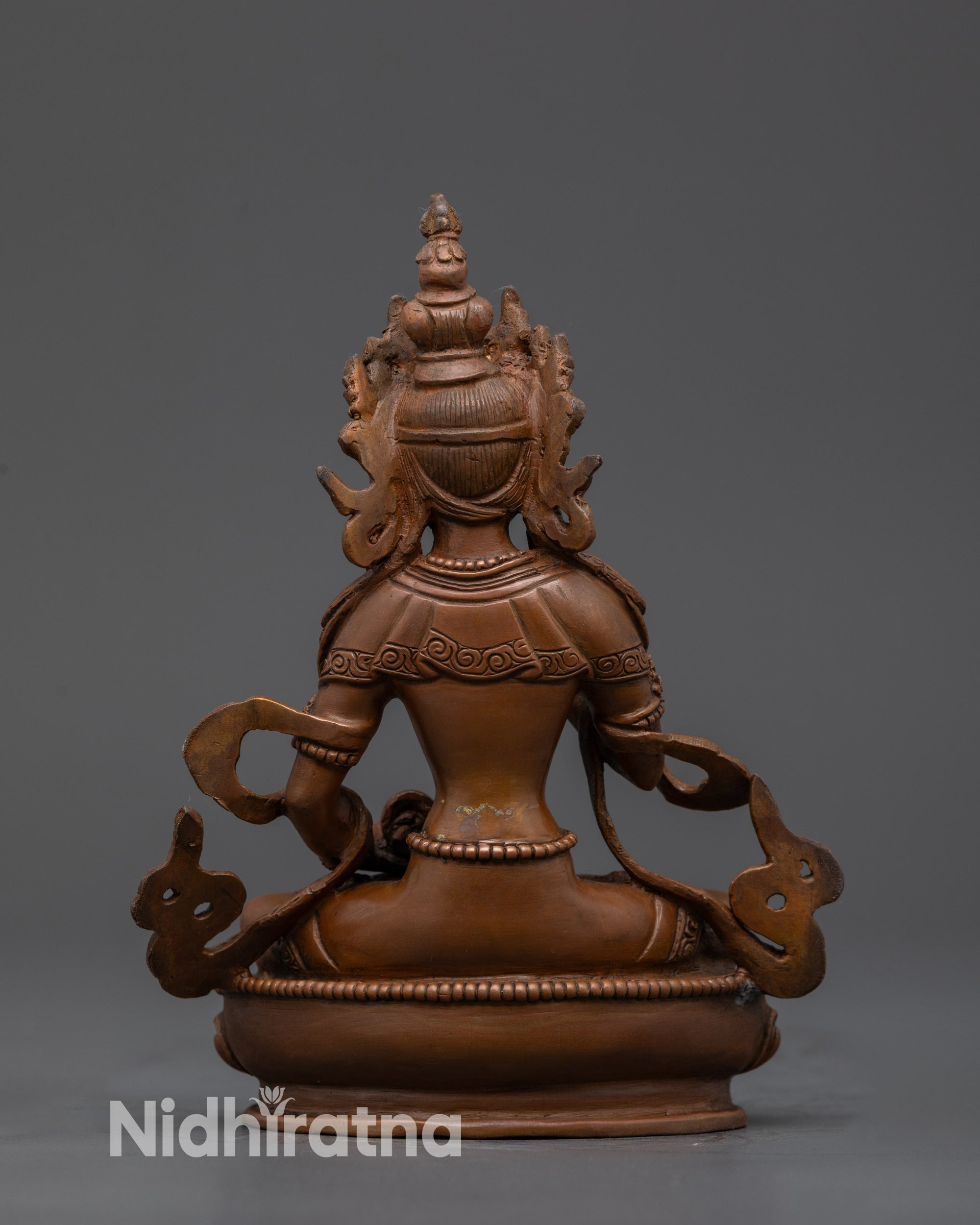 Back view Vajrasattva Nepalese statue highlighting oxidized copper and intricate carving