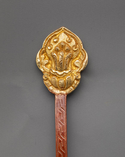 Side view copper Tibetan Spoon with gold-plated finish