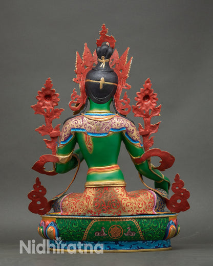 Back view of Green Tara Jetsun Dolma statue with lotus pedestal and engraved copper design