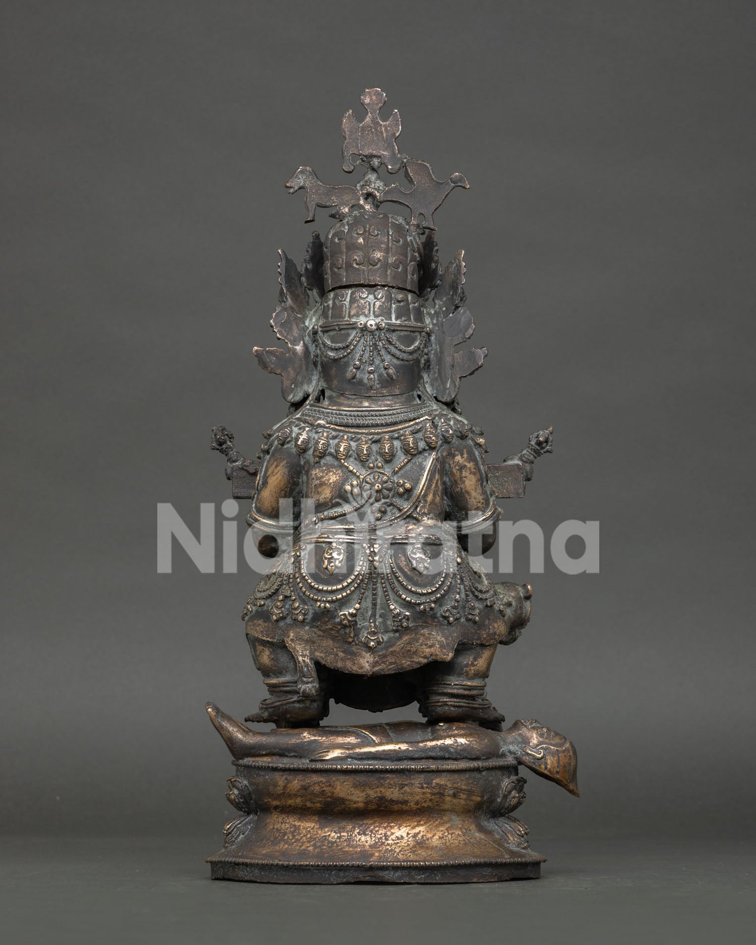 Back view of handmade Sakya Mahakala statue with detailed Nepalese artwork
