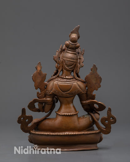 Back view Oxidized Copper Green Tara Statue highlighting carved lotus seat and flowing robe