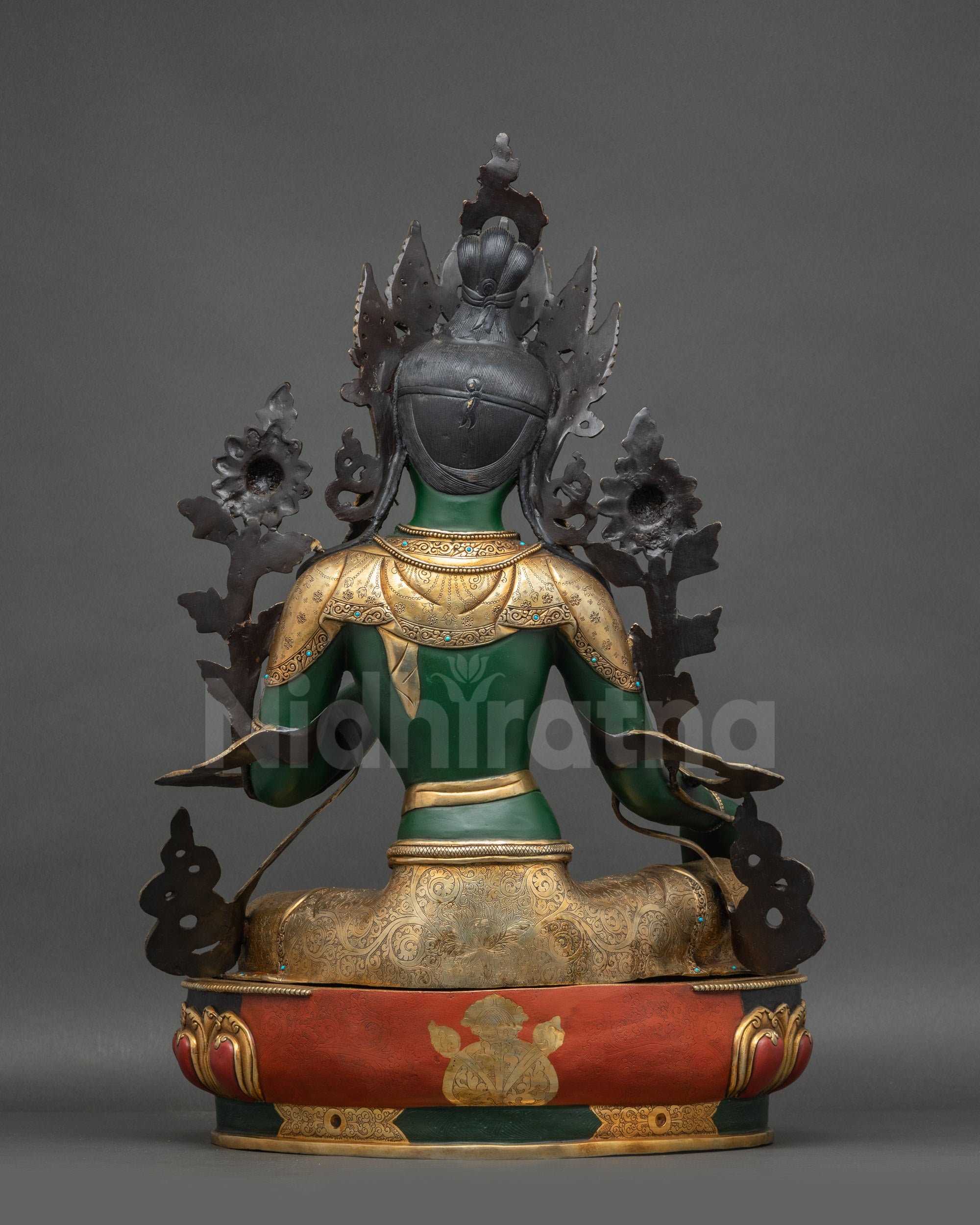 Back view Green Tara statue showing hand-painted back details and lotus base
