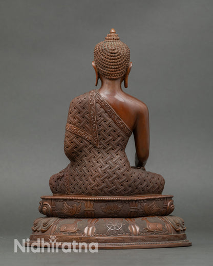 Back view of Buddha Shakyamuni altar statue, copper artwork with intricate detailing