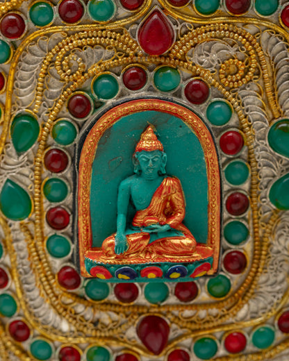 Close-up of Shakyamuni Buddha design on handcrafted Himalayan Flower Vase, adorned with sacred gemstone filigree work from Nepal.