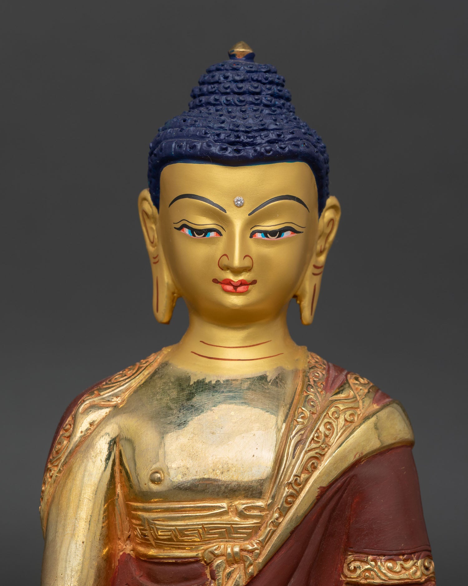 Right profile view of Shakyamuni Buddha statue, handcrafted copper sculpture with gilded spiritual detailing