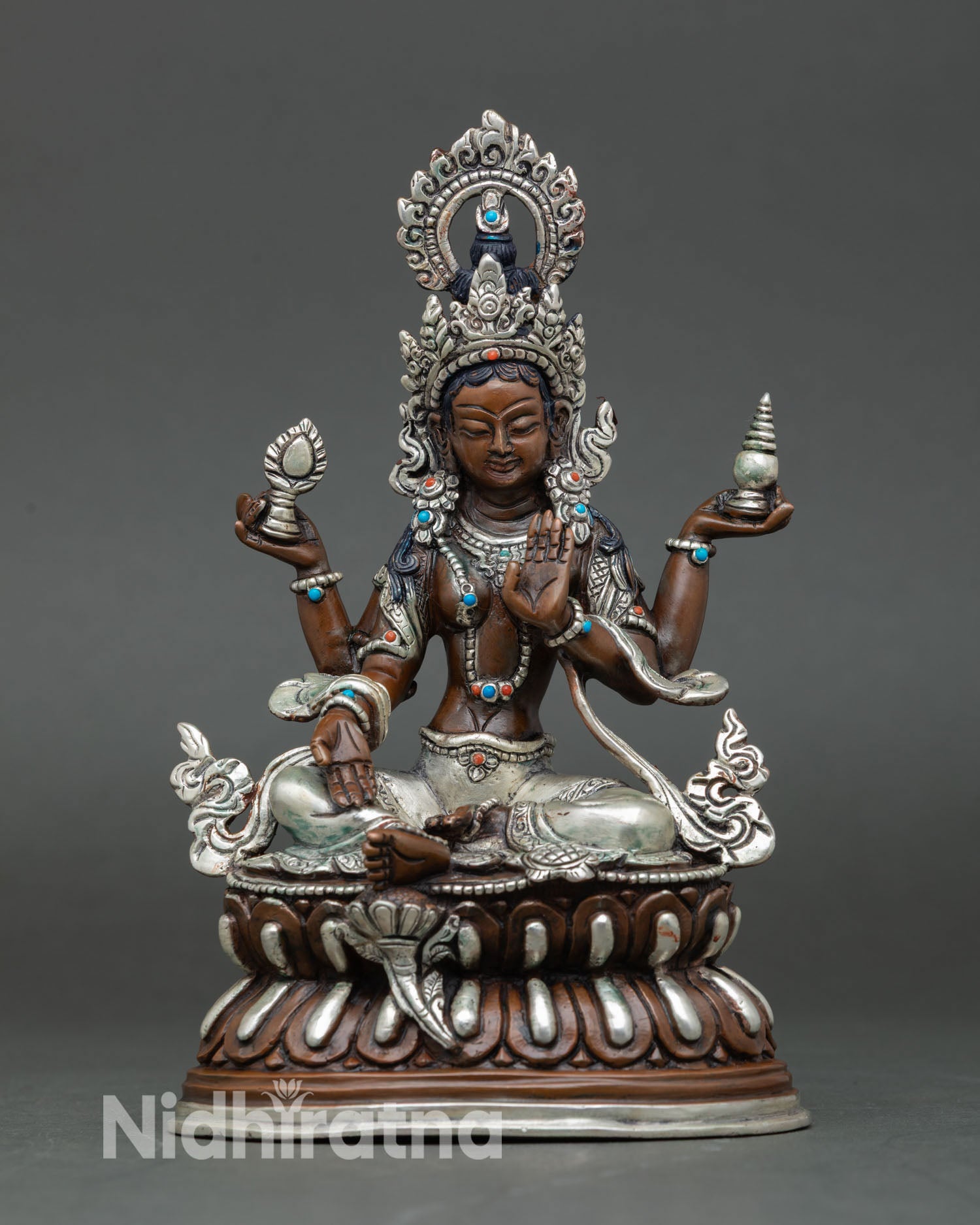 Front view of Laxmi statue oxidized copper silver plated Goddess Lakshmi seated on double lotus throne Nepal art