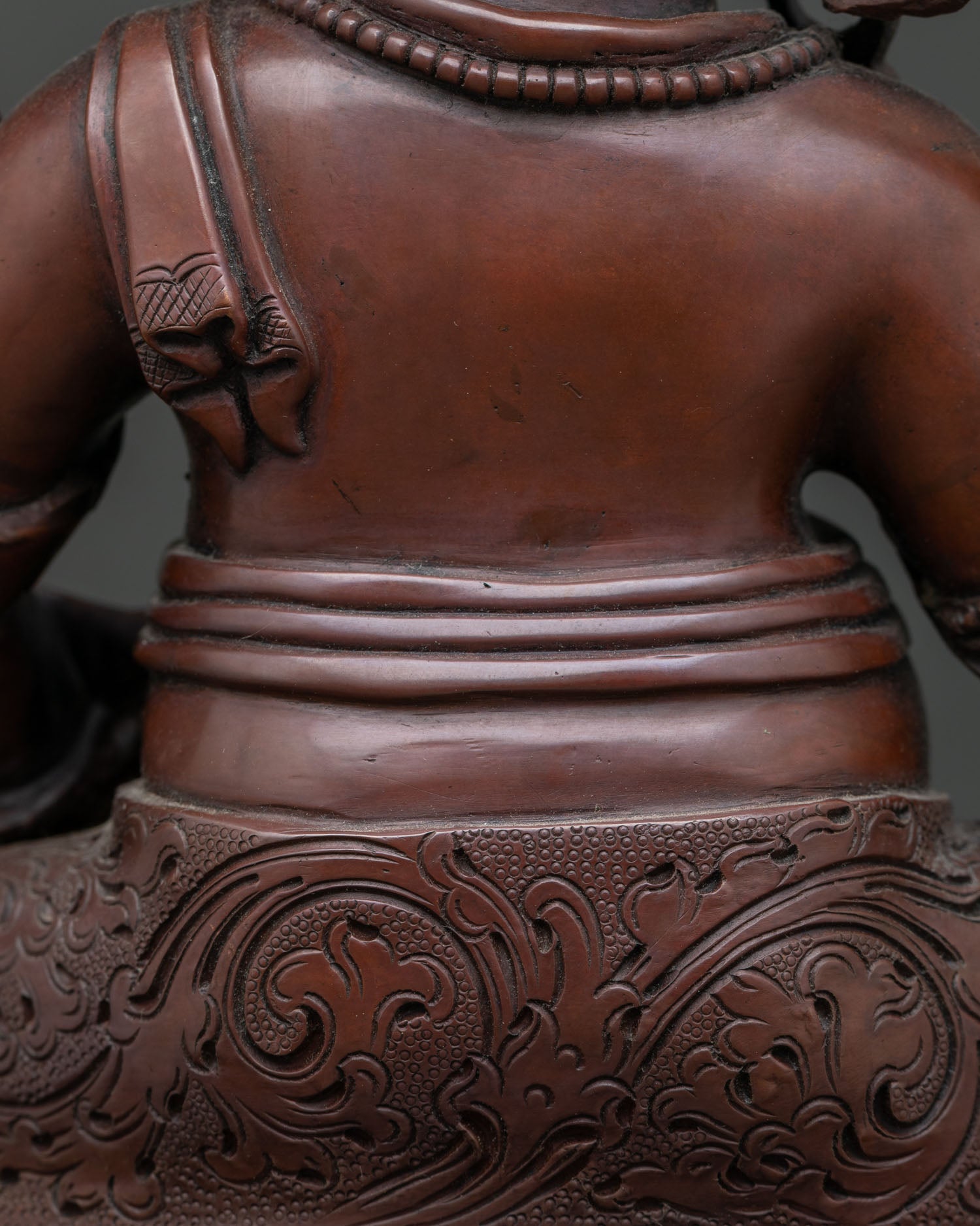 Dzambhala In Ornate Throne Statue | Brown Oxidized Copper Sculpture