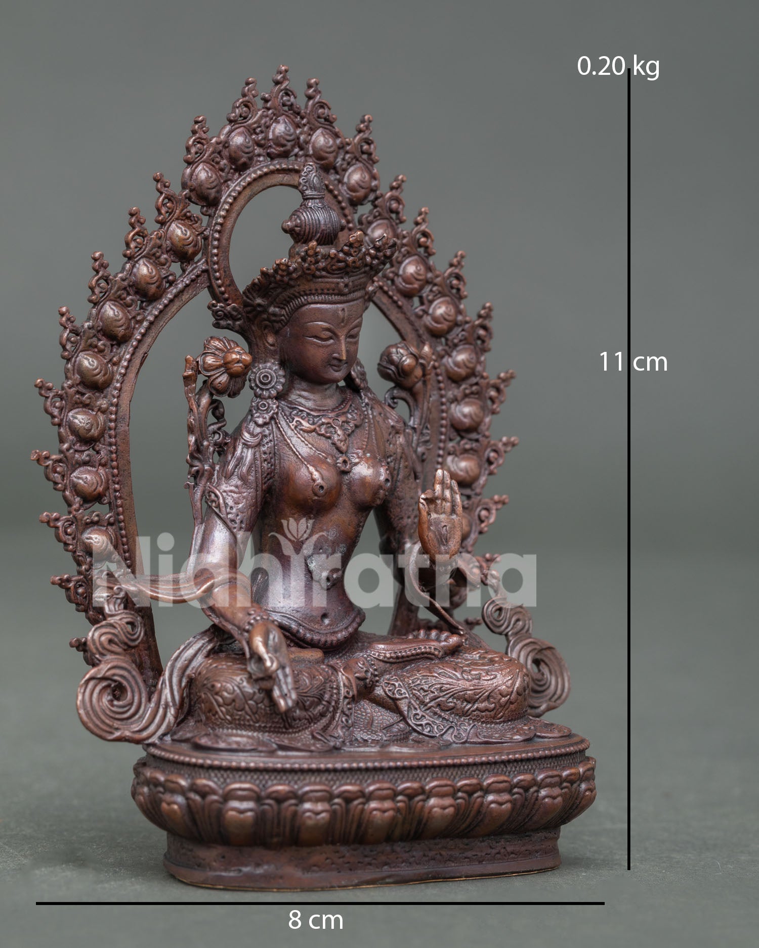 Side view of White Tara Statue on lotus pedestal, handcrafted in Patan, Nepal