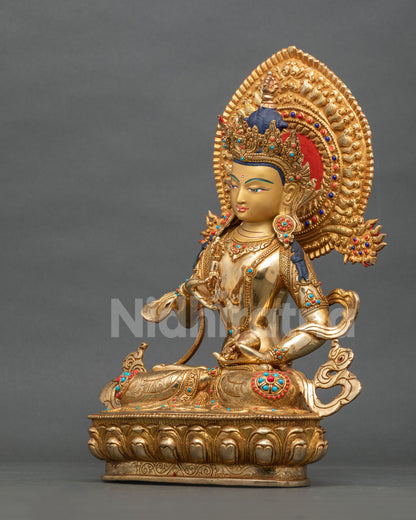 side-profile-of-gilded-vajrasattva-seated-on-lotus-pedestal-beneath-a-scrollwork-halo