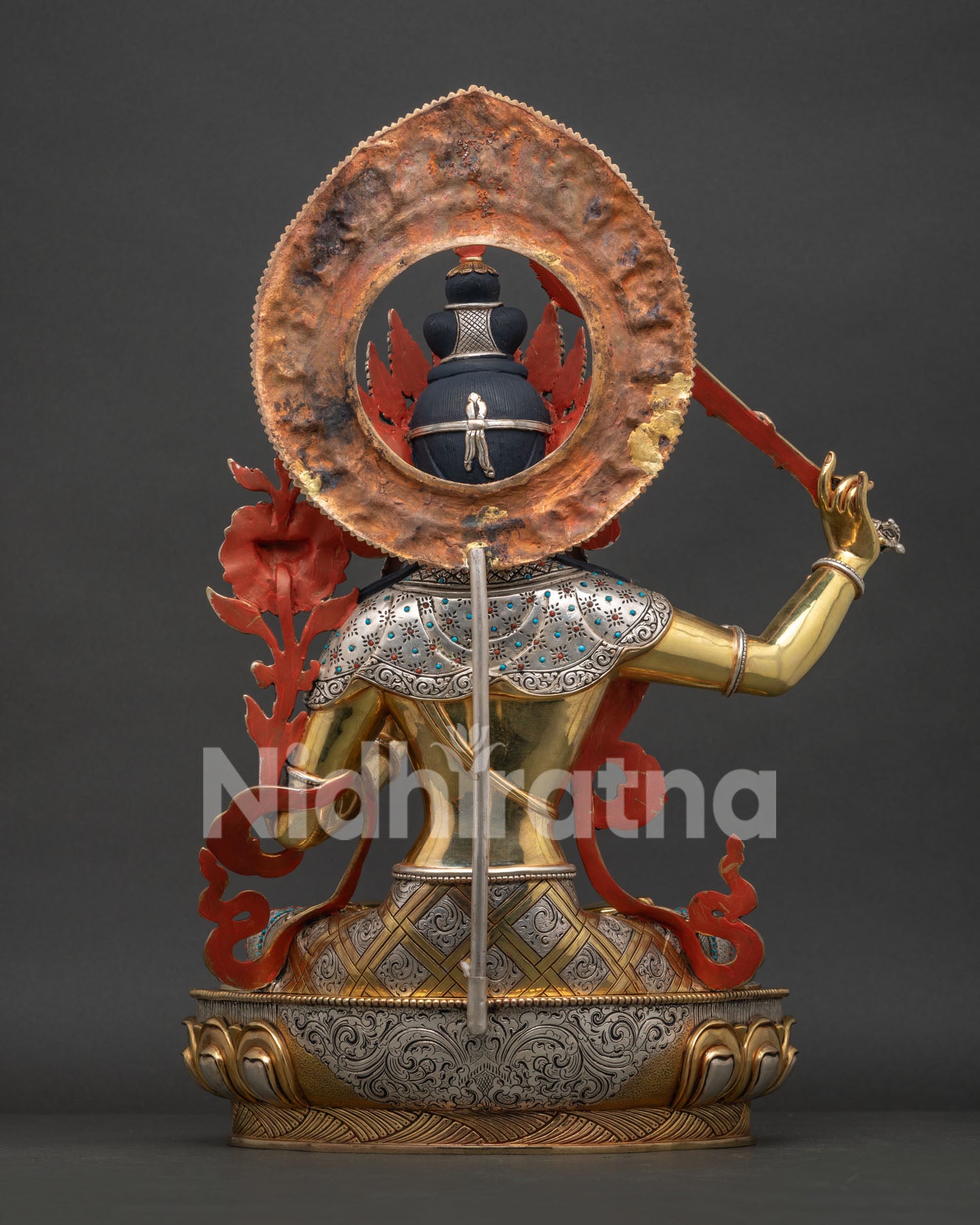 Back view of Manjushri Statue with detailed halo engraving and traditional Newari craftsmanship