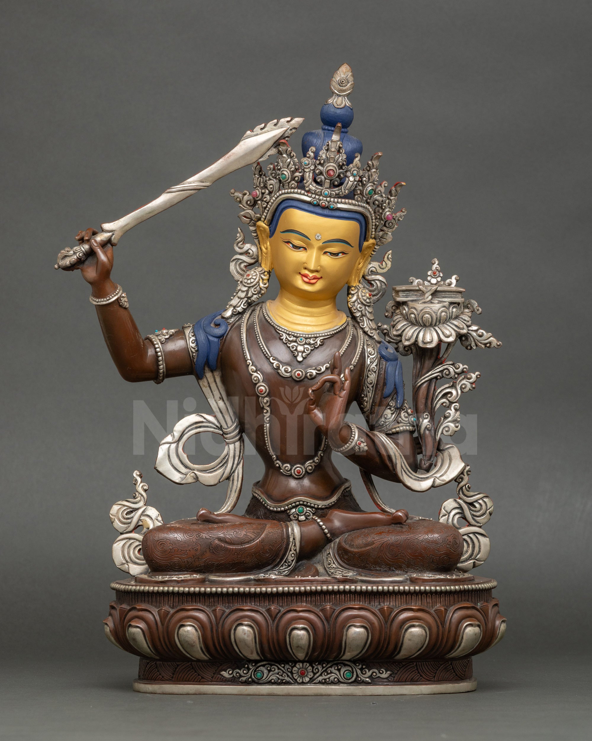 Front view Manjushri statue copper oxidized gold-painted face Nepalese Buddhist deity