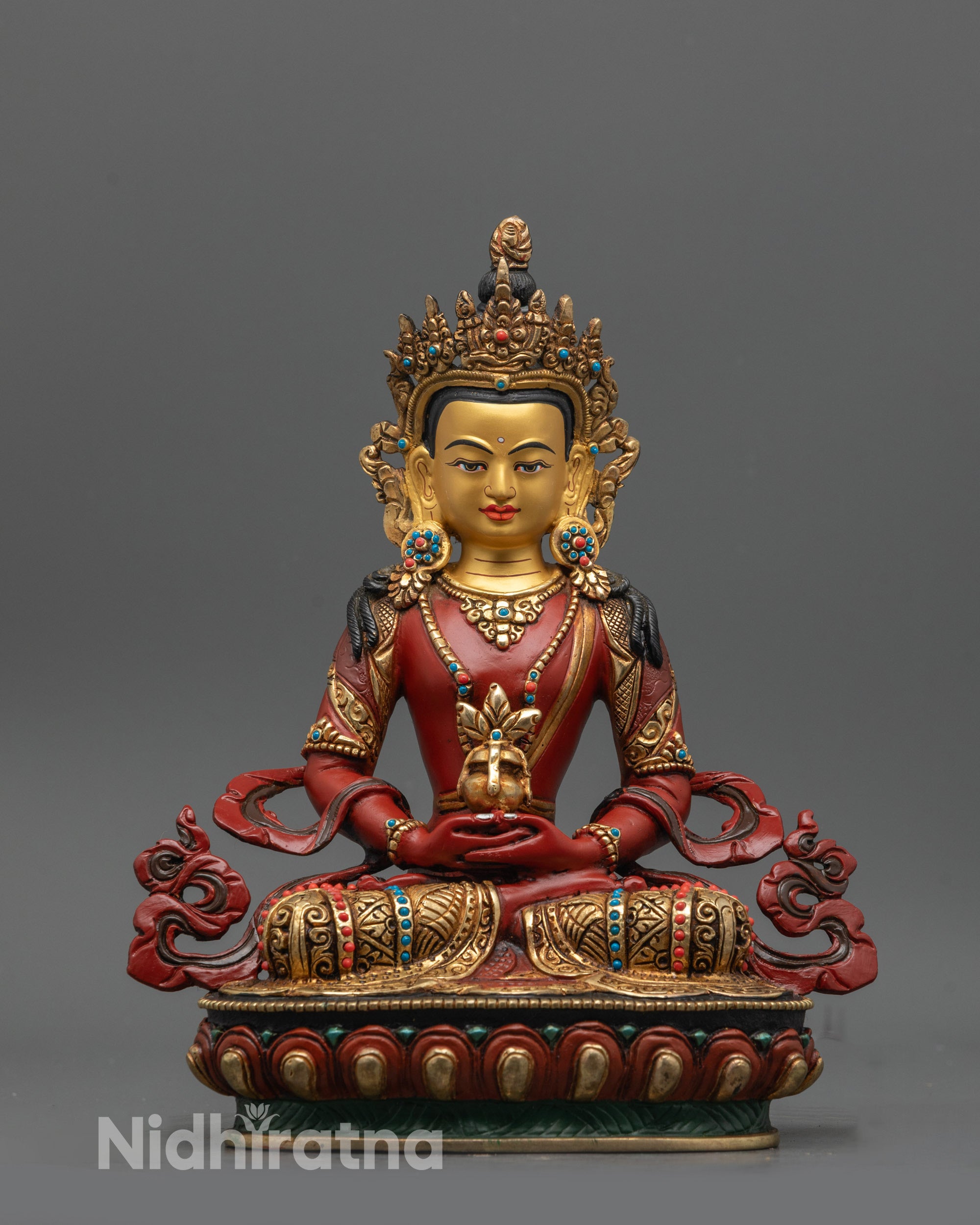 Red Hued Amitayus Buddha statue front view with gold-plated face and red-painted body