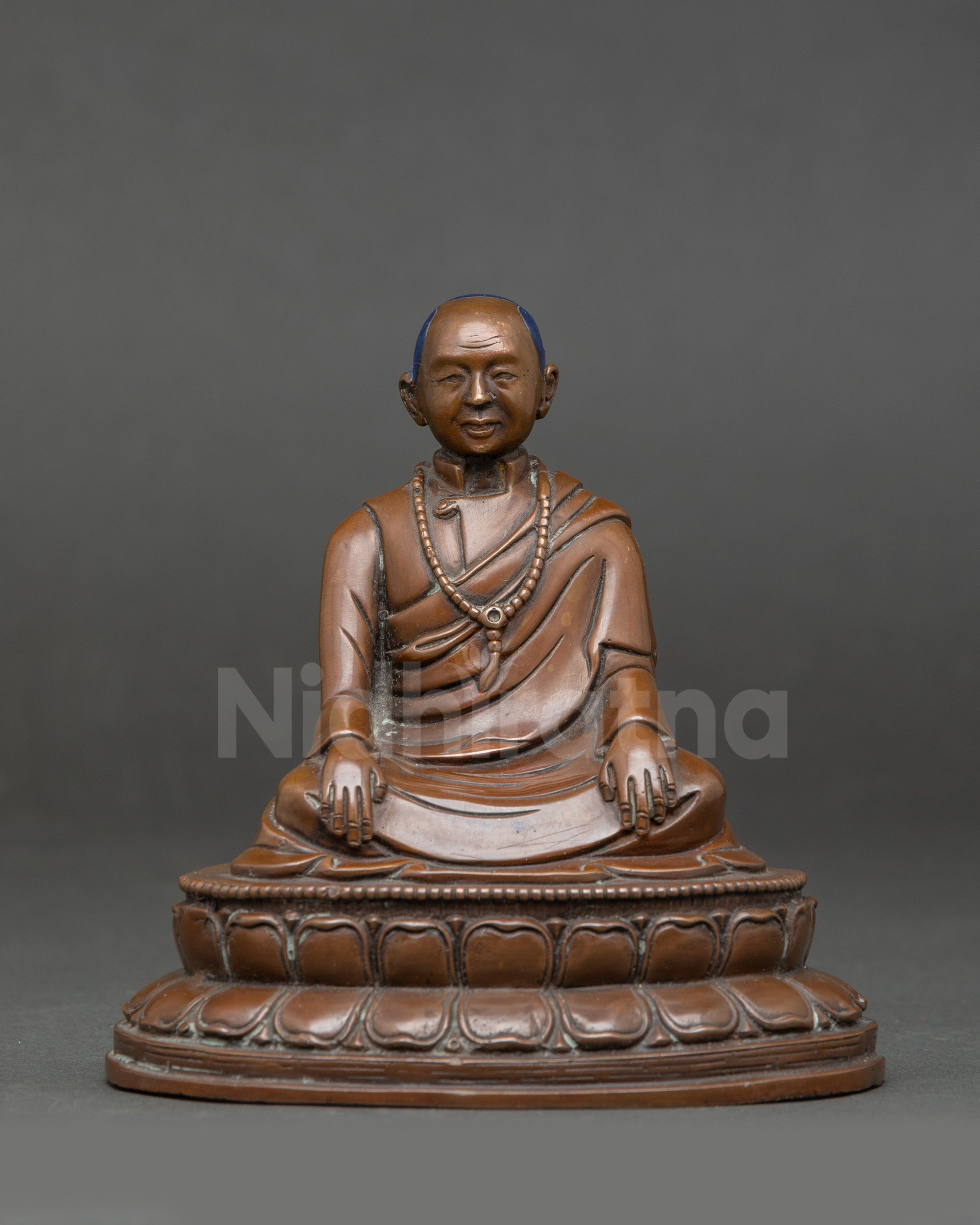 Seated cross-legged on lotus base, meditation altar decor