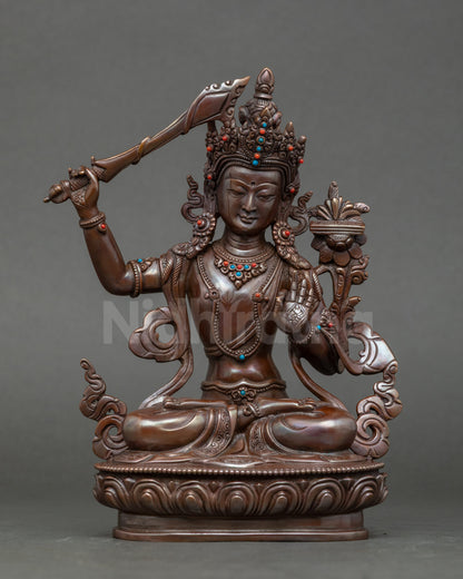 Front view Manjushri Buddha statue, copper with oxidized finish, handcrafted Nepalese art
