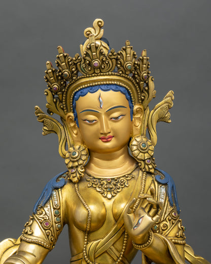 Face close-up Dukar Sitatapatra statue with gold painted face and crown