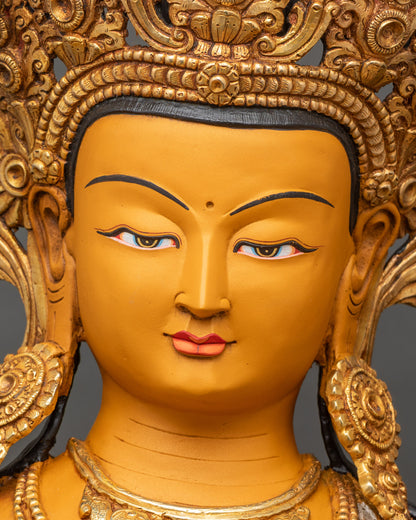 Face close-up of Manjushri Bodhisattva, serene expression, gilded copper