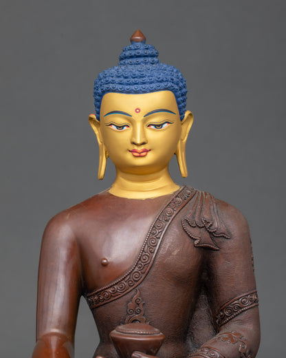 Face detail of Shakyamuni Buddha statue with hand-painted gold expression