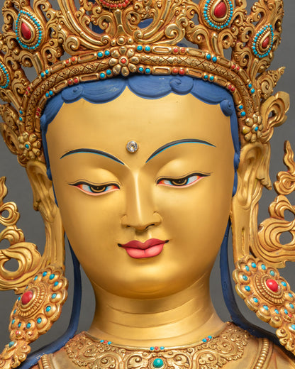 Face of Green Tara statue, serene expression, gold fire-gilded craftsmanship