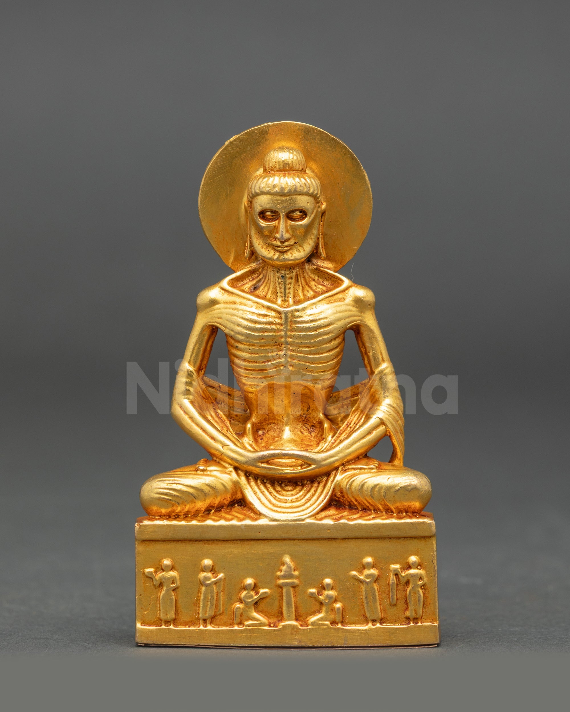 Fasting Buddha Statue front view gold fire-gilded face seated on lotus in ascetic posture