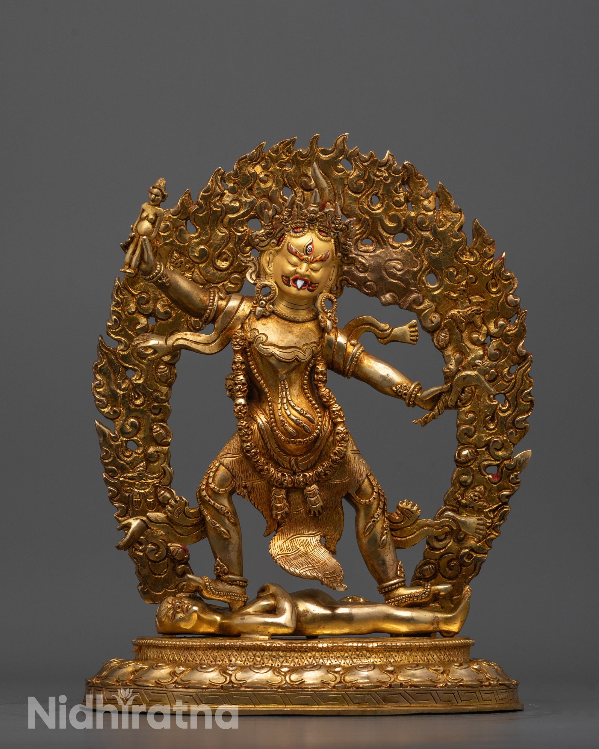 Fierce Ekajati statue standing on a subdued figure symbolizing mastery over negativity
