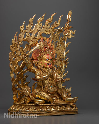 Fierce Four-Armed Mahakala statue showcasing traditional fire-gilding and intricate craftsmanship