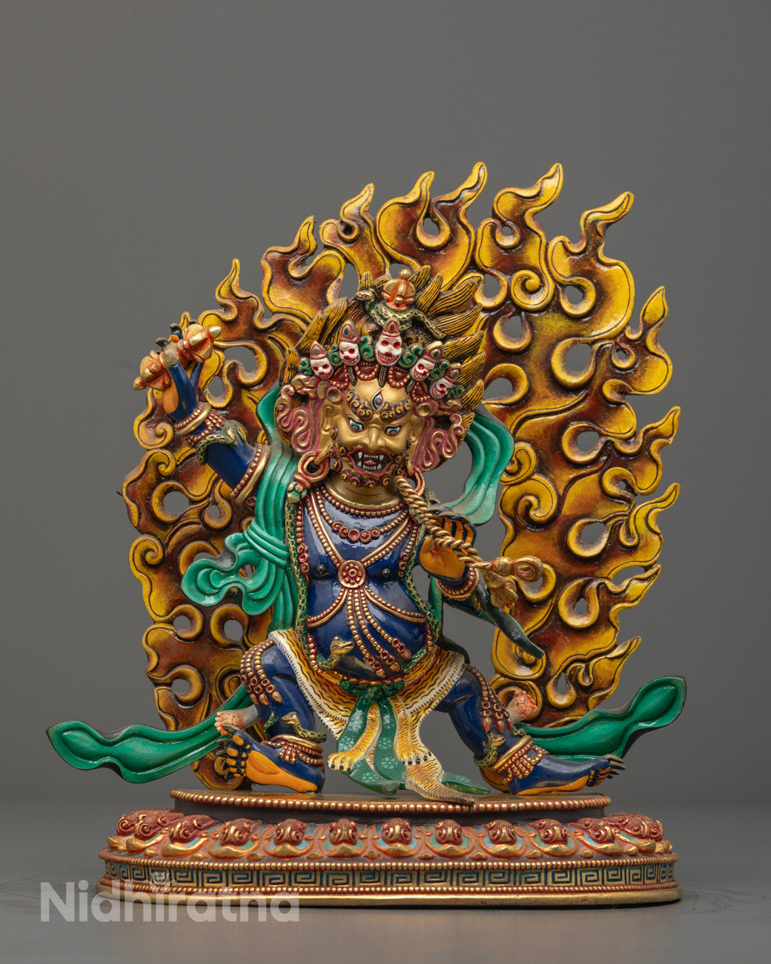 Fierce Vajrapani Bodhisattva statue with gold-gilded face, fire-gilded body, vivid acrylic details, seated on lotus throne with sun disc, handcrafted using traditional lost wax method