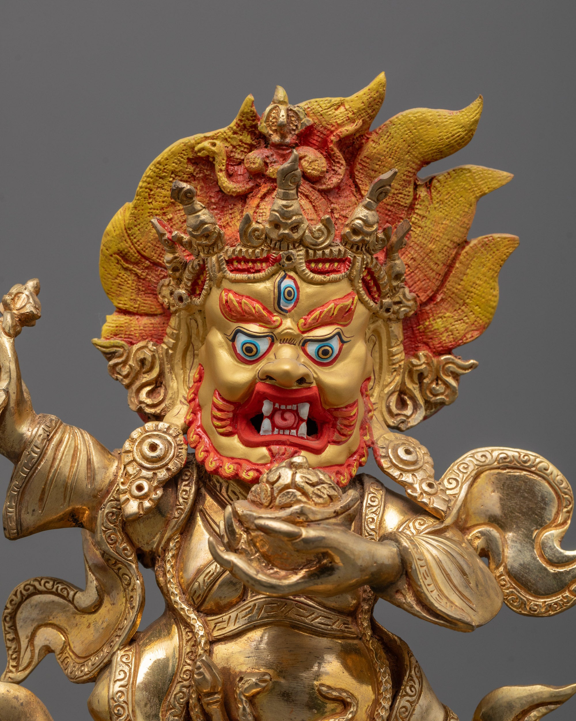 Fierce face of Mahakala Bernagchen with detailed crown and expressive eyes