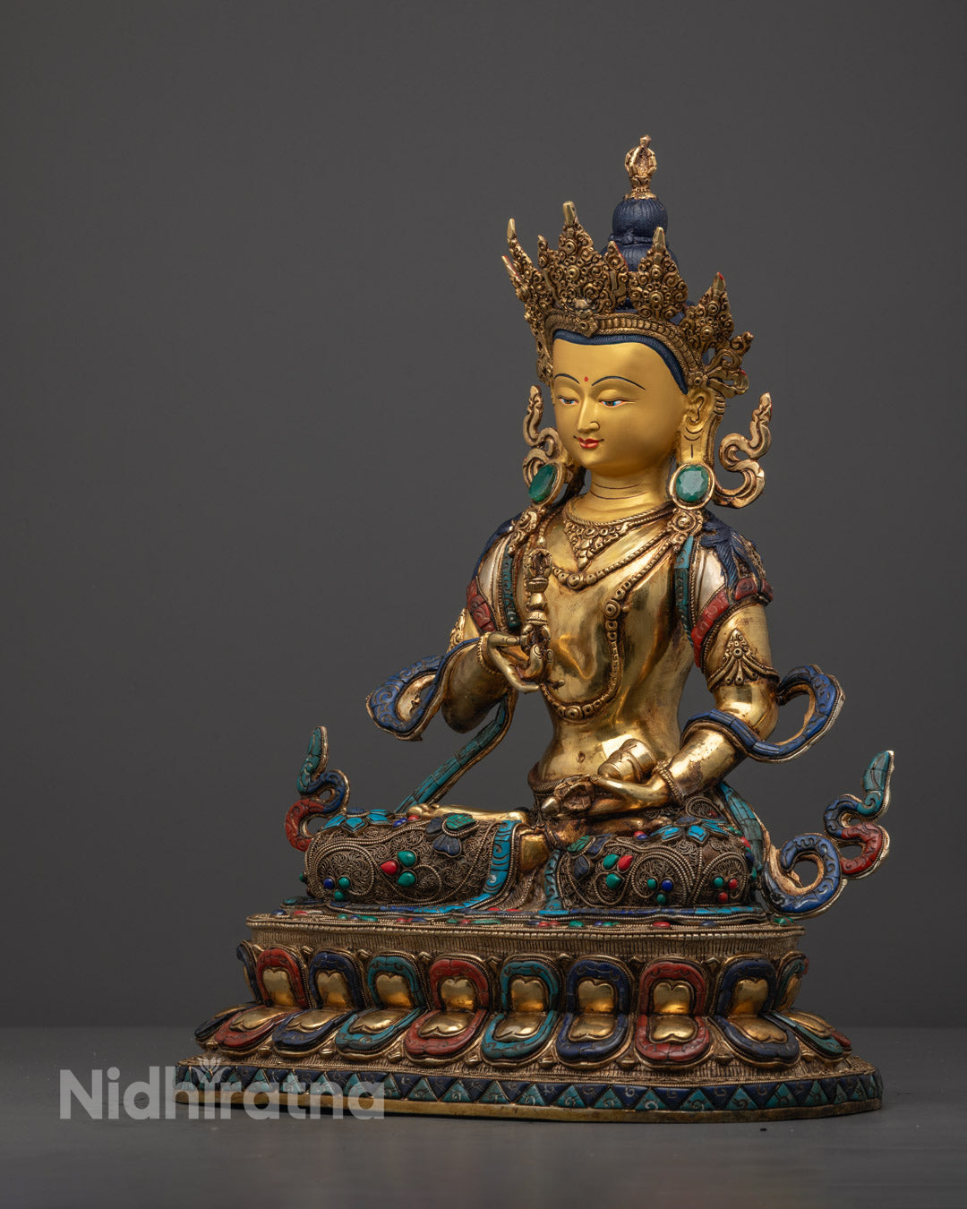 Finely carved dhoti and gemstone-adorned lotus throne on Vajrasattva statue, showcasing lost wax technique and spiritual craftsmanship