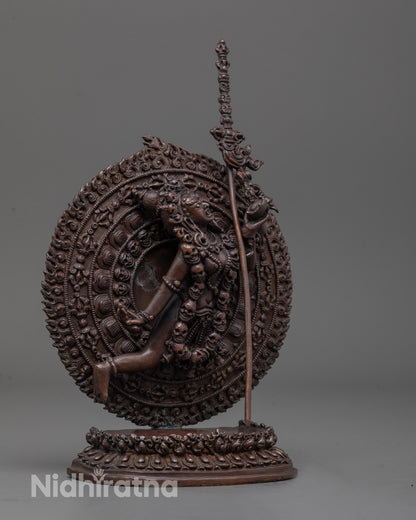 side angle of dynamic flying posture with flowing robes on oxidized copper Vajrayogini statue