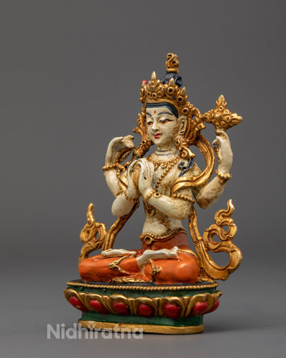 Four-Armed Avalokitesvara Statue holding mala, utpala flower, and wish-fulfilling gem, embodying protection, compassion, and spiritual awakening.